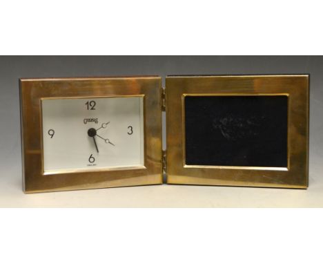 A contemporary silver travelling alarm clock by Carr's England, as a folding photograph frame, Sheffield 2001. 