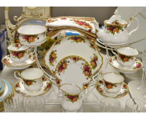 A Royal Albert Old Country Rose part tea service inc. Batchelors teapot, milk jug, sugar bowl, cake plate etc. 