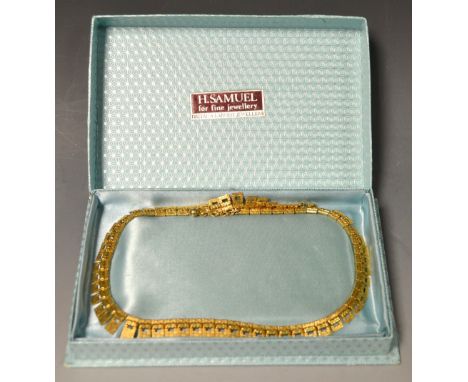 A 9ct gold articulated panel fringe necklace, 20g gross, boxed 