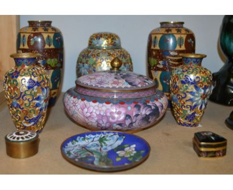 A pair of Japanese Cloisonne enamel vases, decorated with panels of butterflies; a garniture, comprising jar and a pair of va