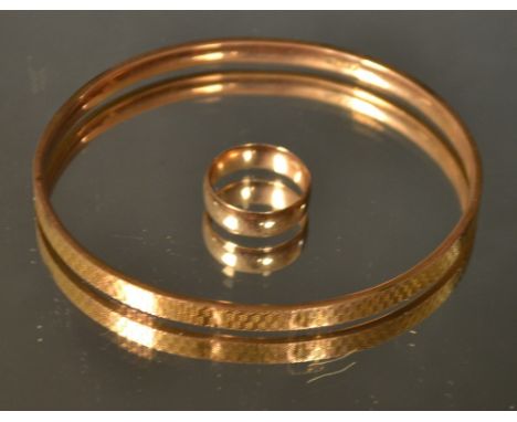A 9ct rose gold wedding band; a 9ct hollow filled bangle, 10.5g gross