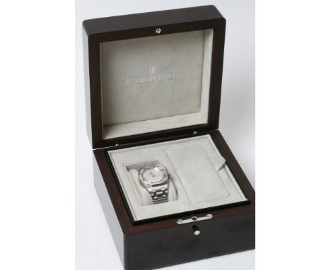A fine Quality ladies Audemars Piguet Stainless steel watch with a diamond bezel in working order and original box 