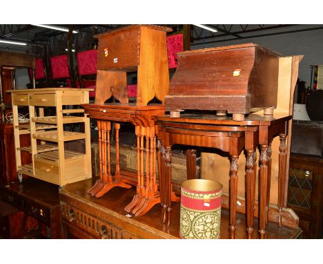 A YEW WOOD NEST OF FOUR TABLES, an oak lidded chest, a mahogany nest of three tables, Victorian commode, an oak side table, a