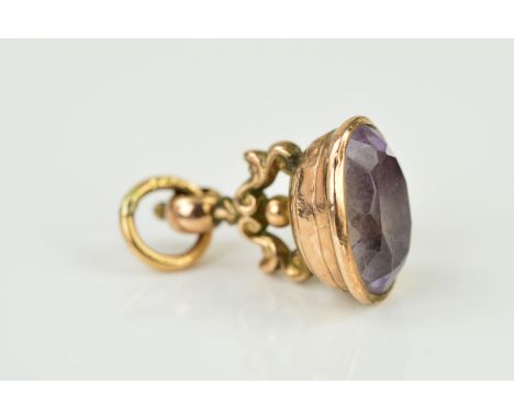 A 9CT GOLD AMETHYST SEAL FOB, an oval mixed cut amethyst measuring approximately 18mm x 13mm, fob measuring approximately 31m