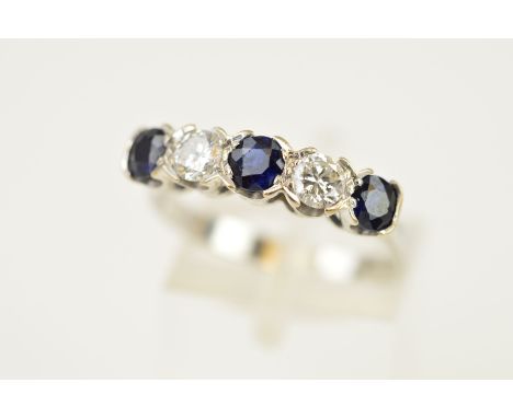 A MID TO LATE 20TH CENTURY SAPPHIRE AND DIAMOND HALF HOOP FIVE STONE RING, estimated modern round brilliant cut weight 0.40ct