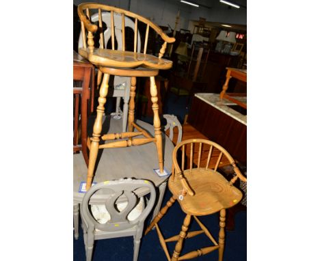 A PAIR OF LIGHT OAK SWIVEL BAR STOOLS