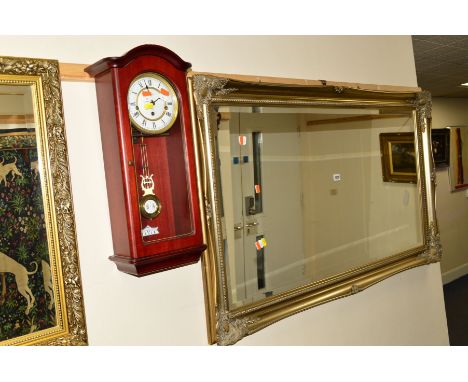 A MODERN RECTANGULAR FOLIATE FRAMED BEVELLED EDGE WALL MIRROR, 129cm x 76cm, together with a modern wall clock (2)