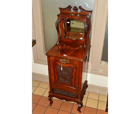 A VICTORIAN CARVED WALNUT COAL PURDONIUM, the swan neck pediment above a single shelf and shaped bevelled edge mirror, on cer