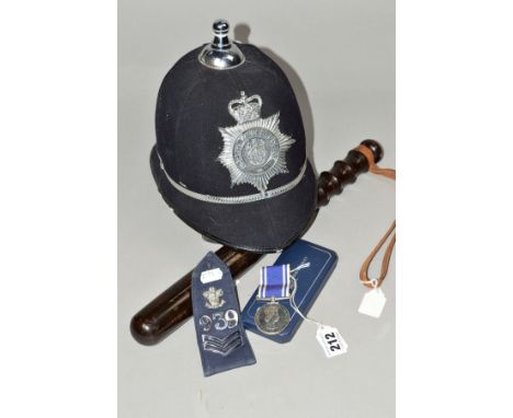 POLICE INTEREST :- A CASED ELIZABETH II POLICE LONG SERVICE AND GOOD CONDUCT MEDAL, stamped to edge with 'SERGT ERNEST S. JON