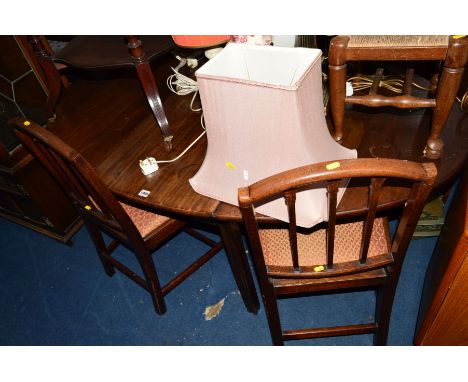 A GEORGIAN MAHOGANY OVAL TOPPED DROP LEAF DINING TABLE and four stick back chairs with drop in seat pads (5)