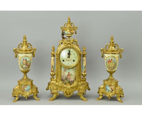 A FRENCH STYLE CLOCK GARNITURE, the clock with movement by Franz Hermle, Germany, striking on a bell, ornate gilt brass case 