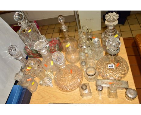 VARIOUS GLASS DECANTERS, COSMETIC BOTTLES etc, to include a ship's cut glass decanter with silver collar and various bottles 