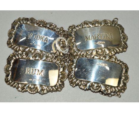 A SET OF THREE ELIZABETH II SILVER DECANTER LABELS, Martini, Rum and Vodka, maker Richards &amp; Knight, London 1973, togethe