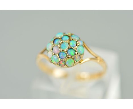 AN EARLY 20TH CENTURY OPAL ROUND CLUSTER RING, round cabochon cut opals, ring size M, stamped '9c', approximate gross weight 