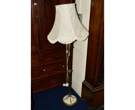A BRASS AND ONYX STANDARD LAMP with a shade