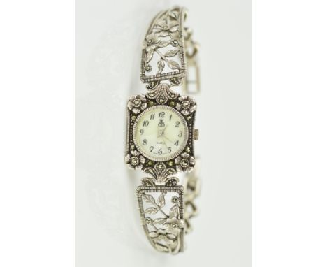 A MODERN SILVER AND MARCASITE LADIES WRISTWATCH, floral panels forming a bangle style, mother of pearl dial, quartz movement,