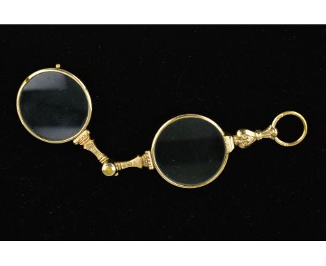 A PAIR OF EARLY 20TH CENTURY GOLD PLATED CENTURY LORGNETTES with spring release mechanism, engraved in foliate decoration