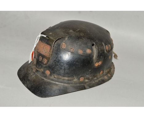 A VINTAGE MINERS HELMET, not marked but possibly a Huwood 'Light Type Hat', circa mid 20th century