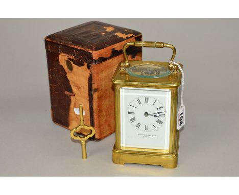 AN EARLY 20TH CENTURY BRASS CARRIAGE CLOCK, enamel dial with Roman numerals, names 'Jackman &amp; Son, Bath', gong strike, he