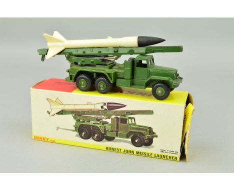 A BOXED DINKY TOYS INTERNATIONAL HONEST JOHN MISSILE LAUNCHER, No.665, complete with missile (some yellowing to plastic) in l