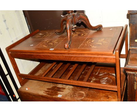 A TEAK FRAMED TILE TOPPED COFFEE TABLE