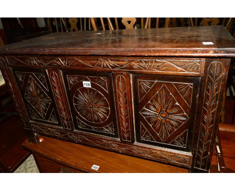 A 20TH CENTURY CARVED OAK TRIPLE PANEL BLANKET CHEST, width 91cm