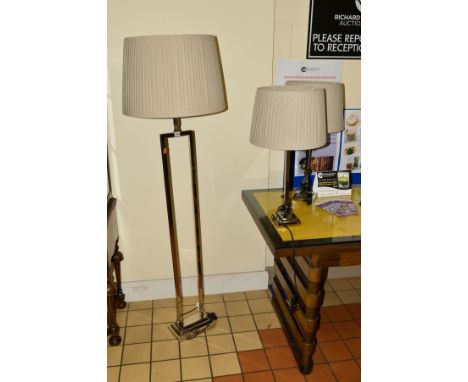 A MODERN DECORATIVE CHROME FRAMED STANDARD LAMP, height 166cm, together with a matching pair of tables lamps, all with light 