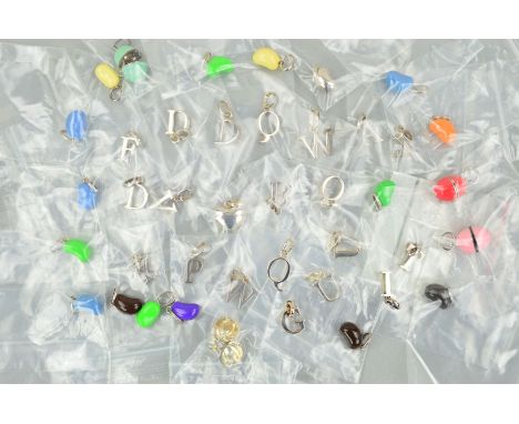 A SELECTION OF SILVER MOLLY BROWN CHARMS to include enamel bean shape charms, letter charms and hinged enamel egg charms, all