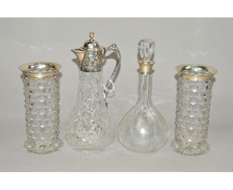 AN ELIZABETH II SILVER MOUNTED CUT GLASS CLARET JUG, with crown finial to domed cover, the neck embossed with floral emblems 