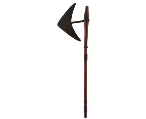 A 19TH CENTURY ZULU OR SWAZI AXE, with 24.5cm head of characteristic form with raised medial ridge and circular shaft, the wo