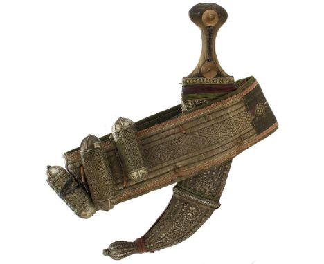 A 19TH CENTURY JAMBIYA ENSEMBLE, 21.5cm sharply curved blade with raised medial ridge, characteristic white metal mounted hil