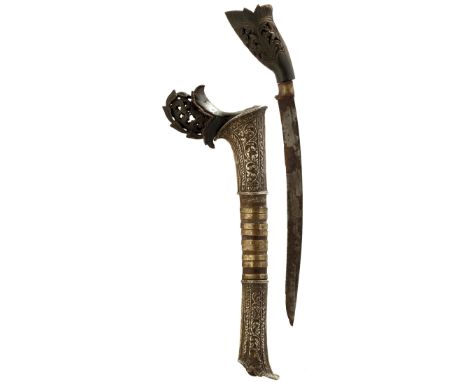 A WHITE METAL MOUNTED RENCONG DAGGER, 17.5cm curved blade, characteristic carved horn hilt decorated with scrolling foliage, 