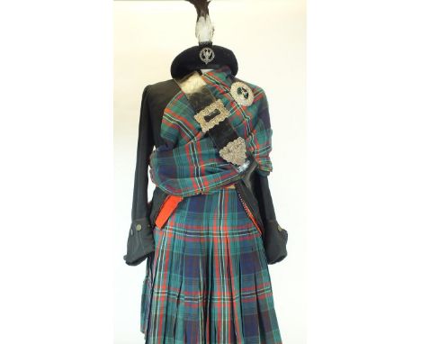 A VICTORIAN HIGHLAND DRESS ENSEMBLE, comprising chased white metal plaid brooch pierced with a stag's head emerging from a co