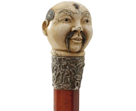 A 19TH CENTURY ORIENTAL SWORD STICK, the ivory pommel carved as the head of a gentleman with abalone inset beetle on his fore