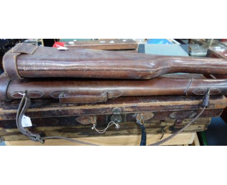 THREE VINTAGE LEATHER GUN CASES and a canvas and leather trimmed gun case (4)