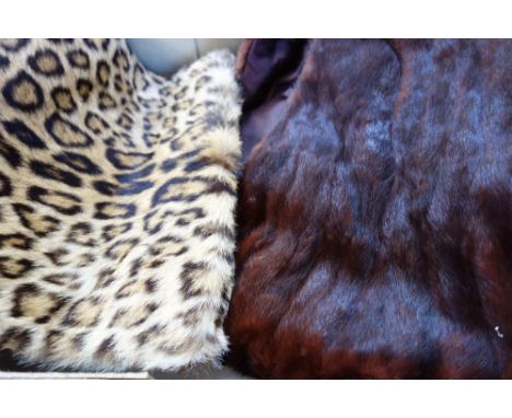 A VINTAGE BROWN FUR STOLE and a Vintage leopard skin muff (2)