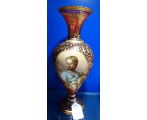 A VICTORIAN CRANBERRY GLASS VASE with central plaque hand-painted with a portrait of a woman, 30cm high