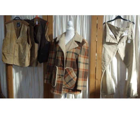 A VINTAGE SINGLE BREASTED SHEEPSKIN DONKEY JACKET, a pair of vintage Levi Strauss jeans and three leather vintage cowboy styl
