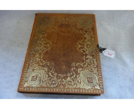 A VINTAGE BOX in the form of a leather bound book