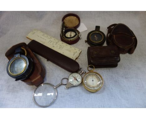 A FIRST WORLD WAR COMPASS, 1915, with leather case and similar items
