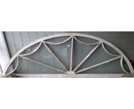 A LARGE ADAM STYLE ARCHITECTURAL FAN LIGHT of arched form, 230 cm wide x 74 cm high