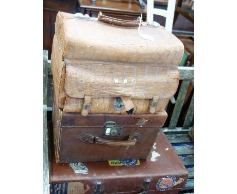 A VINTAGE LEATHER SUITCASE, a leather hatbox with Cunard White Star labels and a crocodile portmanteau fitted for bottles (mi