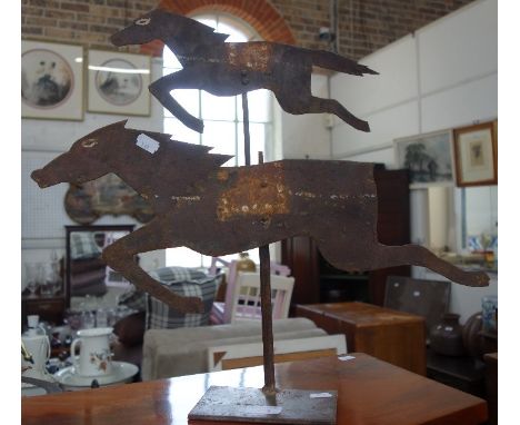 A RUSTIC CUT OUT IRON WEATHER VANE in the form of two horses