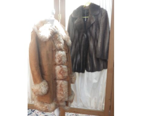 A VINTAGE 1960S BROWN SUEDE AND SHEEPSKIN COAT and a ladies three-quarter length fur coat (2)