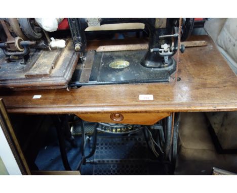 A 'WHITE IMPROVED' treadle sewing machine and another vintage sewing machine