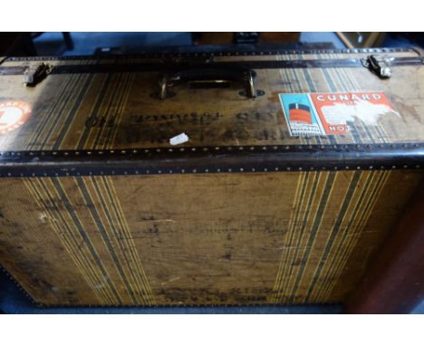 A 1920'S STRIPED CANVAS AND METAL BOUND TRAVEL TRUNK and a Japanned tin trunk