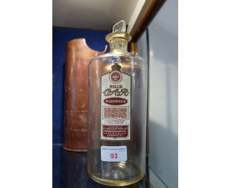 A VINTAGE HILL'S C.A.R. HAIR WASH BOTTLE with glass stopper in a leather case