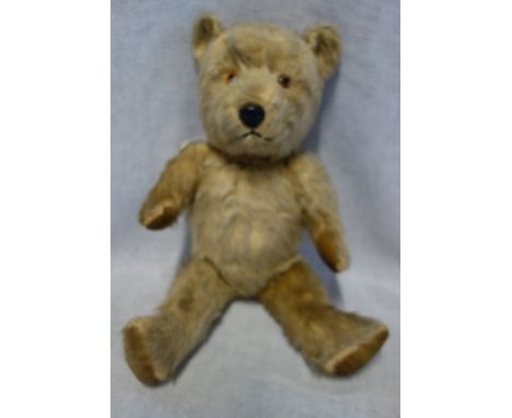 A VINTAGE PLUSH TEDDY BEAR with jointed limbs