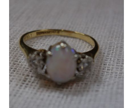 AN OPAL AND DIAMOND RING, on an 18ct yellow gold shank, ring size P-Q