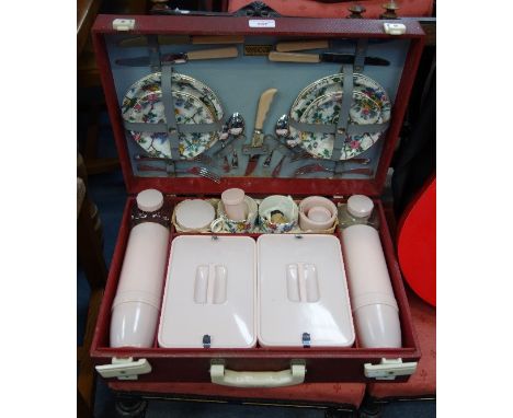 A VINTAGE BREXTON PICNIC SET in red leatherette case